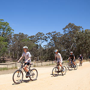 Students riding bikes at Clunes